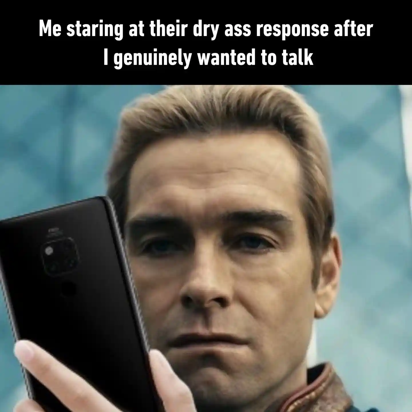 Dry text meme staring at phone unamused
