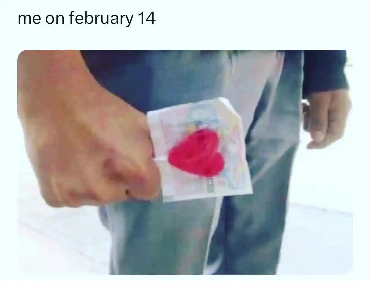 Feb 14 valentine meme holds heart condom