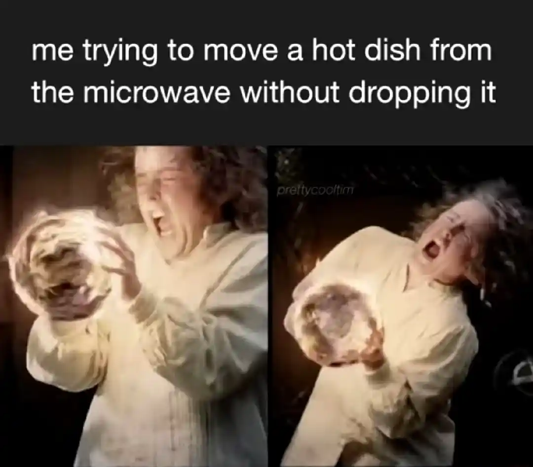 Taking hot dish out of microwave meme struggling not to drop it