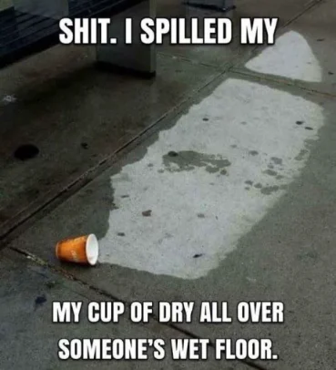 Spilled cup of dry meme empty cup on wet floor