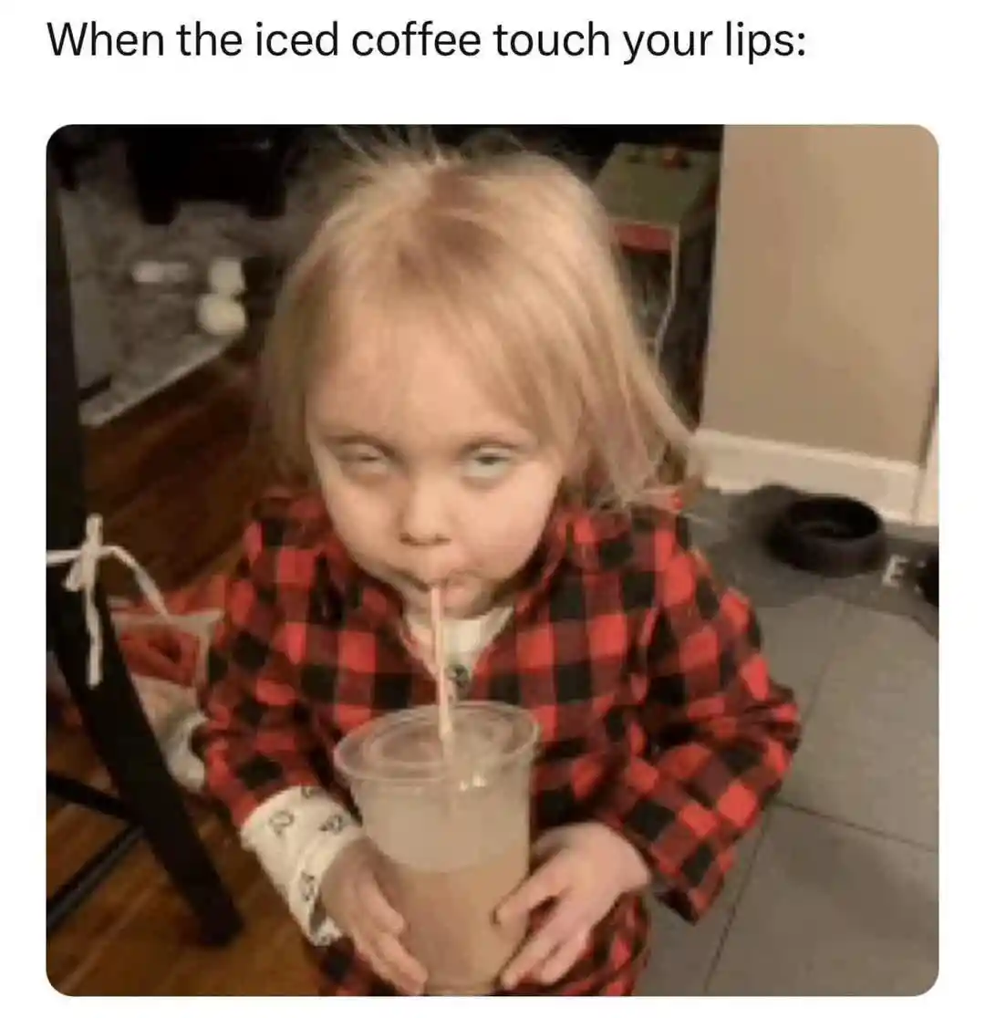 Iced coffee kid meme cross eyed while sipping