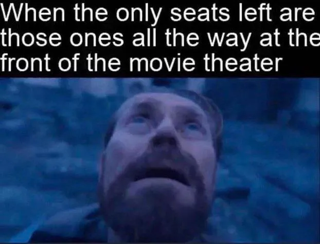 Willem dafoe looking up meme at front movie seats