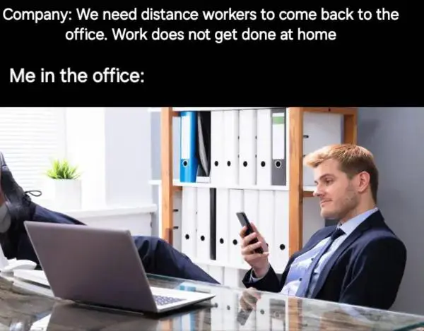 Back to office meme worker scrolling phone at desk